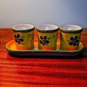 Partylite ceramic 4 piece candle holder set with candles.